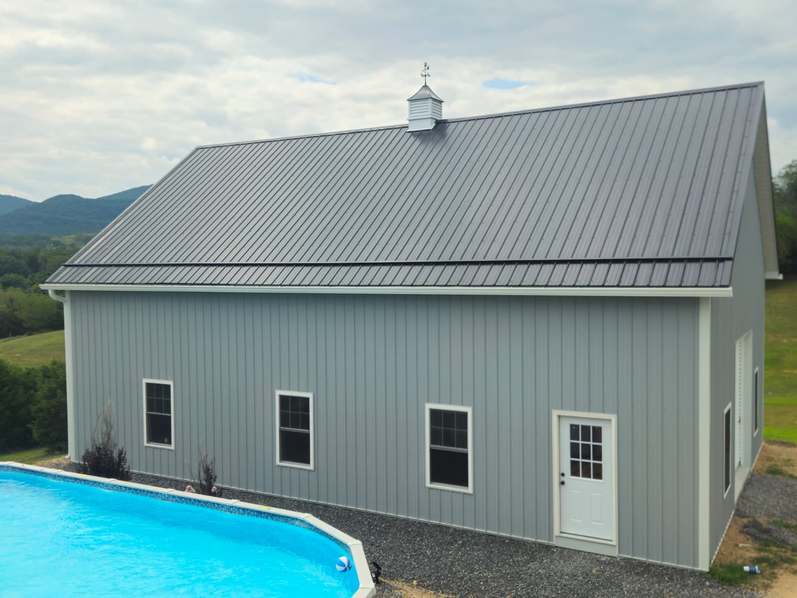 Completed Strongbuilds LLC post-frame building with metal roof in Shanks, WV